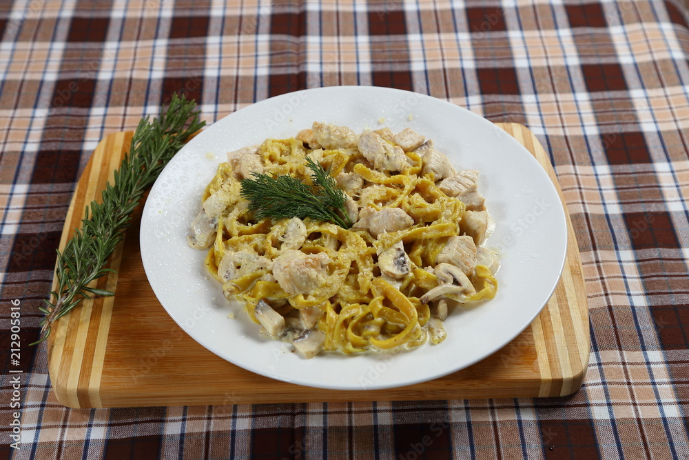 Macaroni of Carbonara with smoked sausage, bacon, sauce. Tasty lunch in the Italian restaurant with herbs, dill Macaroni of Carbonara with smoked sausage, bacon, sauce. Tasty lunch in the Italian restaurant with herbs, dill