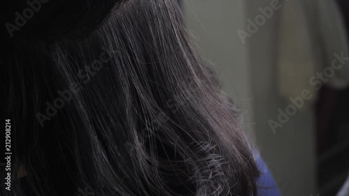 hairdresser using spray setting hairstyle