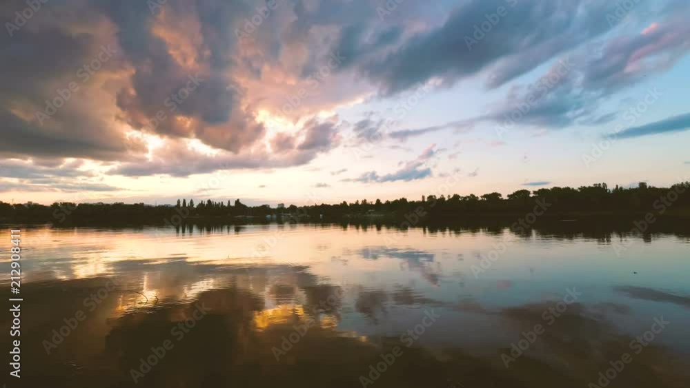 clouds over the lake in the evening at sunset. clouds over the lake in the evening at sunset.