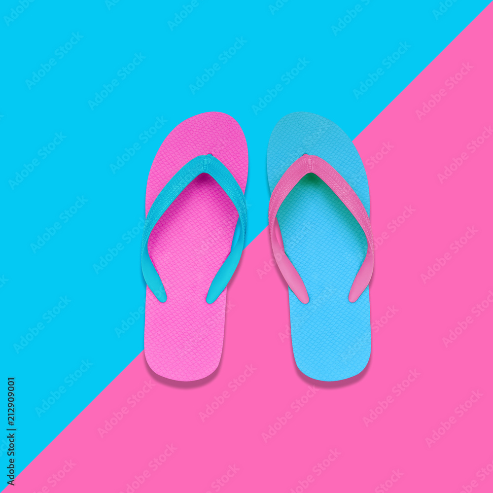 Pink and Blue Flip Flops on pastel colors background