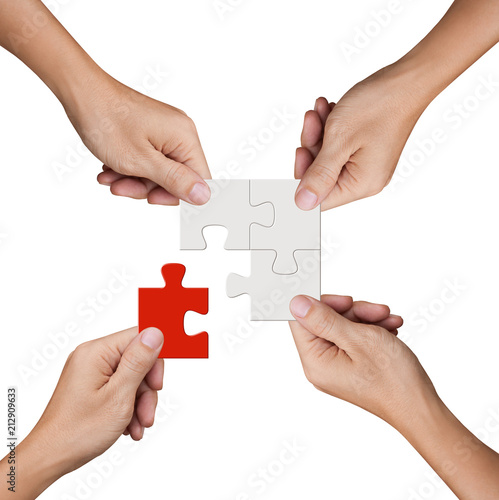 Hand holding jigsaw puzzles, Business partnership and teamwork concept