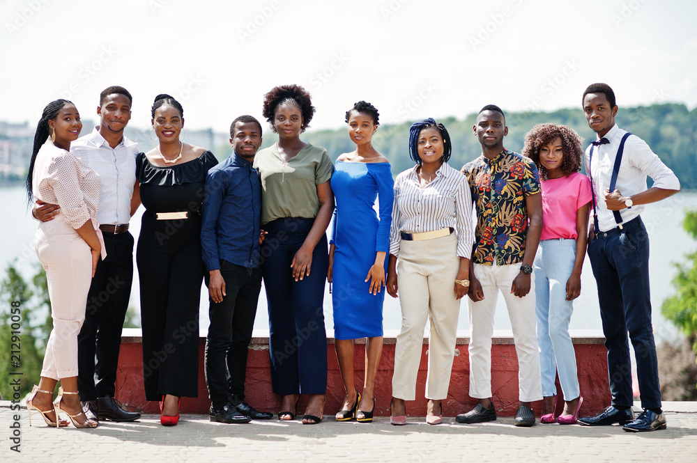 Obraz premium Group of ten african american people posed at street of city. Fashionable people of Africa.