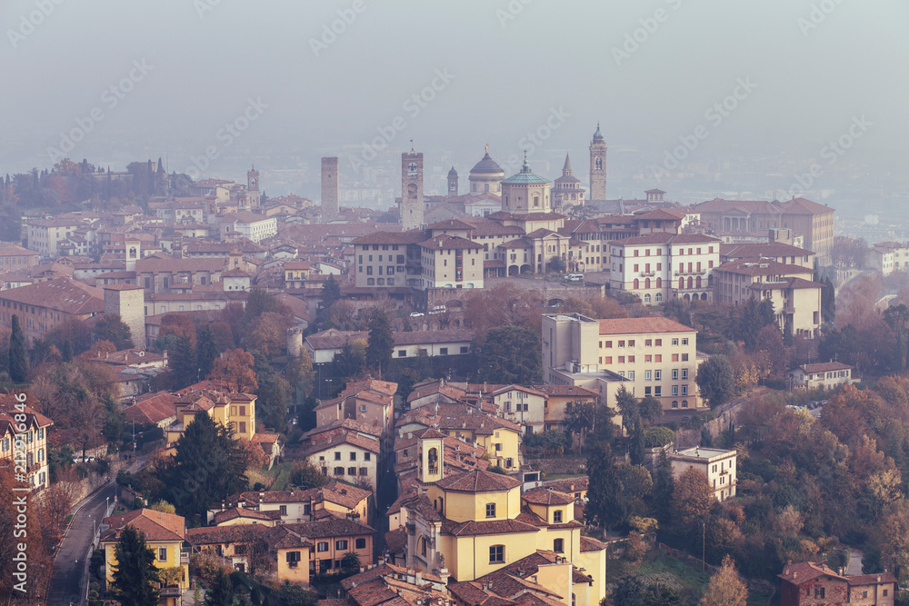 Aerial view of Bergamo in a foggy day, Italy.