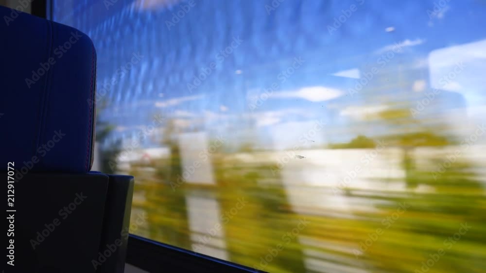 Looking through Train Window at Cars on Highway Looking through Train Window at Cars on Highway
