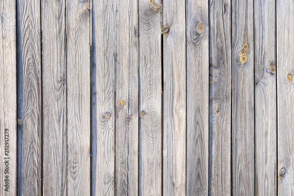 Naklejka premium Old wooden laths background, Texture of untreated wood, Weathered larch background