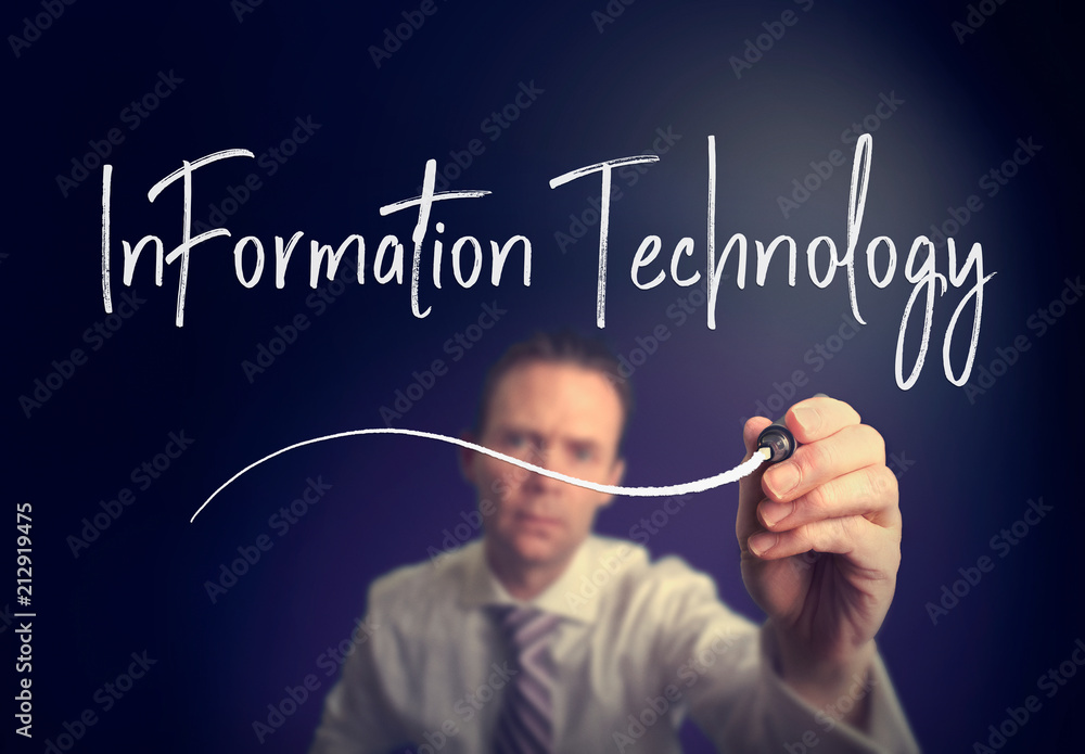 A businessman writing a information technology concept with a white pen on a clear screen. A businessman writing a information technology concept with a white pen on a clear screen.