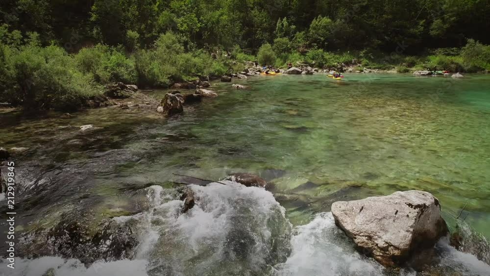 Aerial view of group kayaking at calm water at the Soca river in Slovenia. Aerial view of group kayaking at calm water at the Soca river in Slovenia.