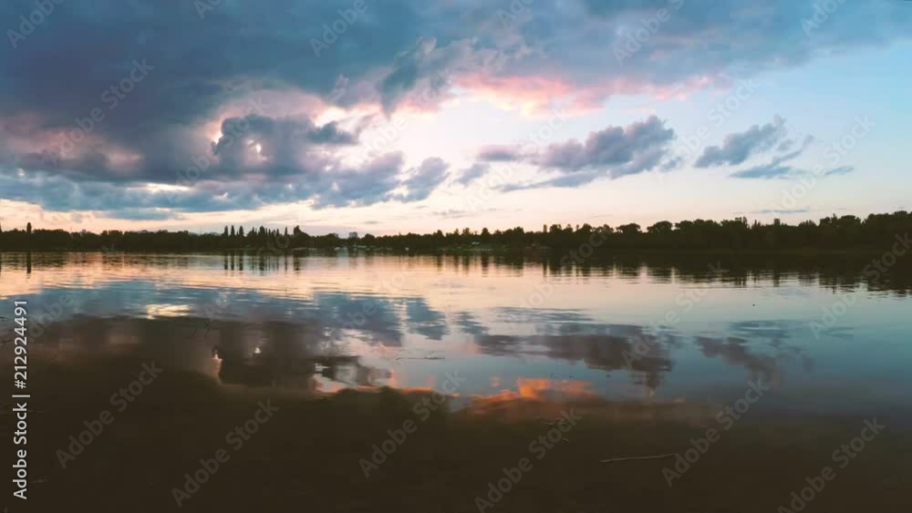 clouds over the lake in the evening at sunset. clouds over the lake in the evening at sunset.