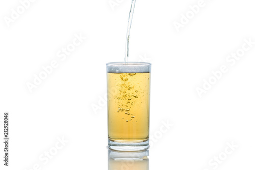 Pour glass of beer isolated on white