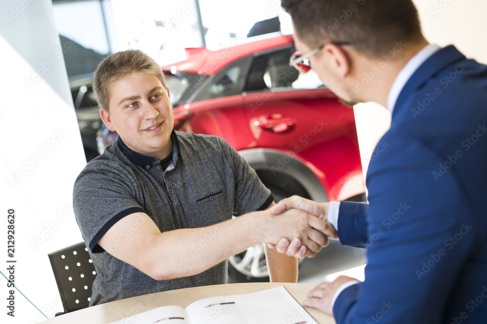 Business car seller working with the client Business car seller working with the client