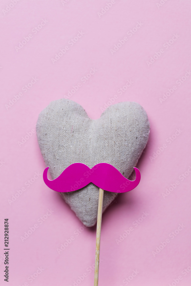 Pink moustache on a pink background. Modern masculinity concept Pink moustache on a pink background. Modern masculinity concept