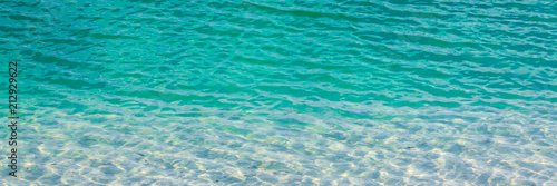 Panoramic view of turquoise water with reflections of light