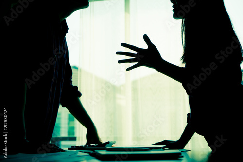 Fotografie Silhouette Asian couple is fighting by the windows