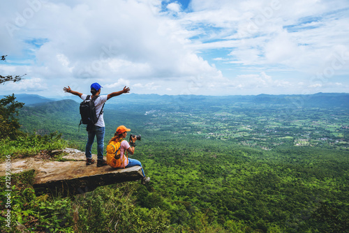 Lover woman and men asians travel relax in the holiday. is on the cliff. photo