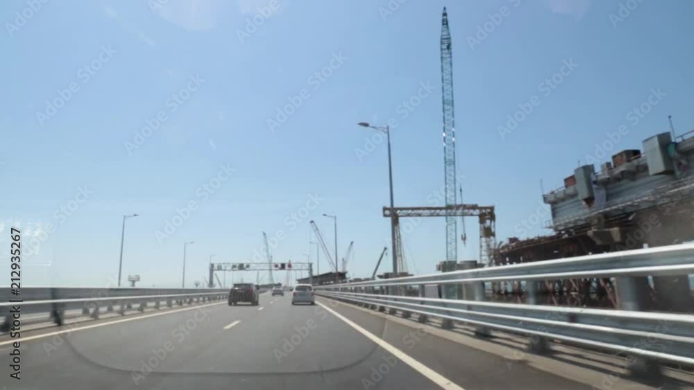 Car is driving over the bridge. Russia, the construction of the Crimean bridge. Car is driving over the bridge. Russia, the construction of the Crimean bridge.