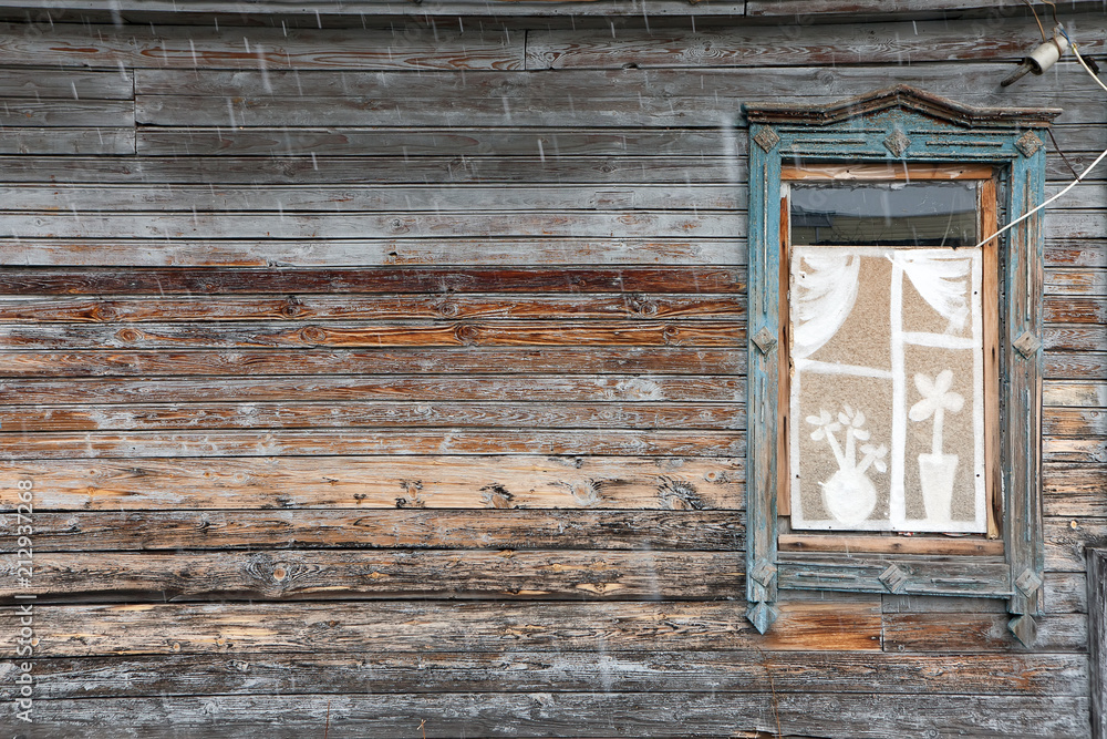 wall of wooden house in rain with pane wall of wooden house in rain with pane