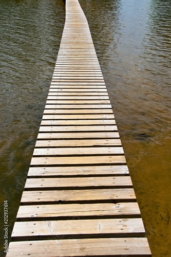 plank footbridge over water