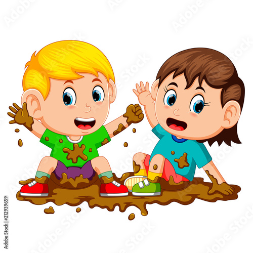 two kids playing in the mud