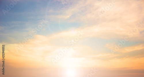 Background of colorful sky concept: Dramatic sunset with twilight color sky and clouds. © paul