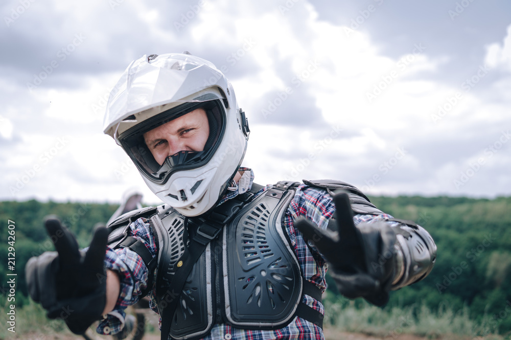 Adventure motorcyclist gear, A motorbike driver looks, close up portait, rider man in helmet, concept of active lifestyle, enduro travel road trip Adventure motorcyclist gear, A motorbike driver looks, close up portait, rider man in helmet, concept of active lifestyle, enduro travel road trip