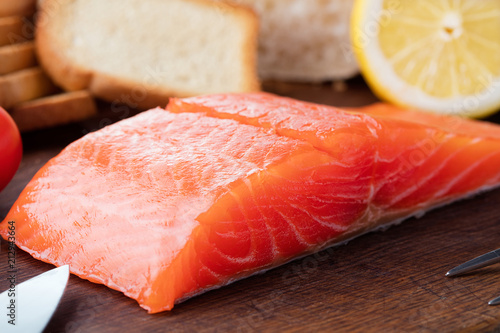 raw salmon fillet on wooden background