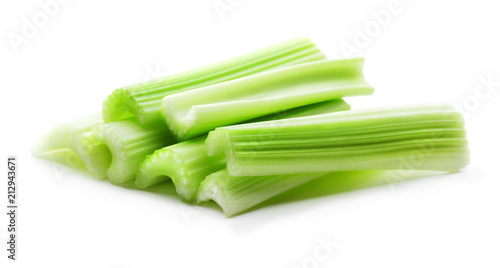 heap of fresh green celery stiks isolated on white background