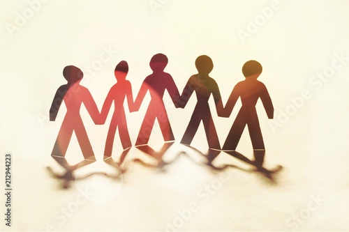 Circle of paper people on white background