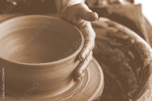 Hand of potter doing clay pot