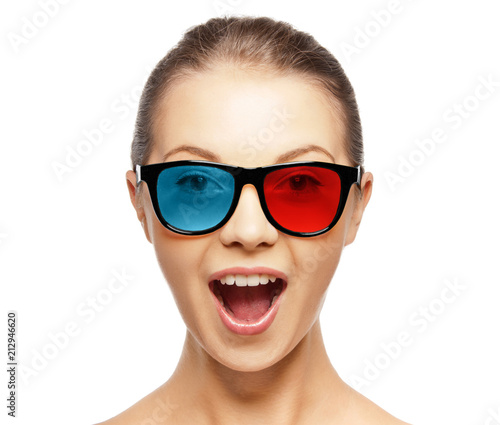 face expressions and people concept - portrait of excited young woman or teenage girl in red blue 3d glasses