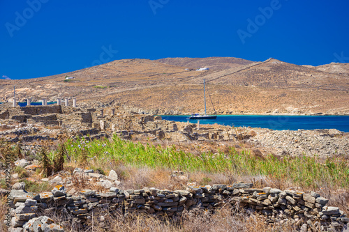 Ancient ruins in the island of Delos in Cyclades, one of the most important mythological, historical and archaeological sites in Greece. photo