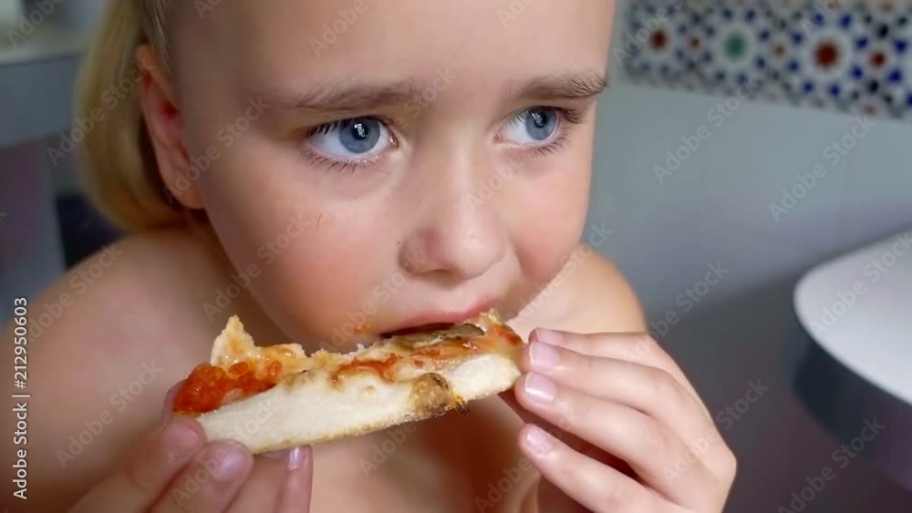 portrait of baby girl eating pizza at home portrait of baby girl eating pizza at home