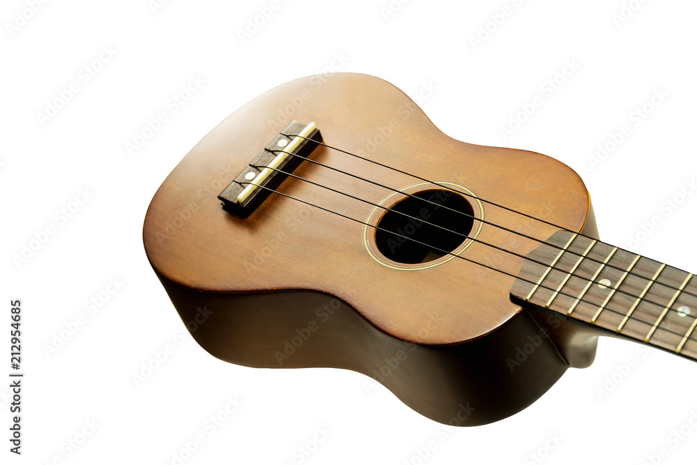 Fototapeta premium The brown ukulele on the white background