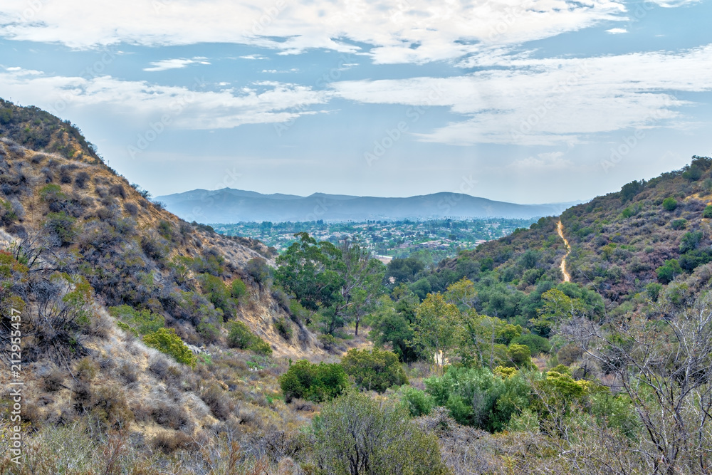 Suburbs with houses in the distance on humid day in California mountains