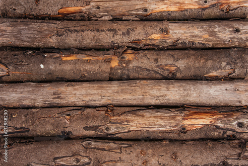 Wooden log wall in the form of a background texture