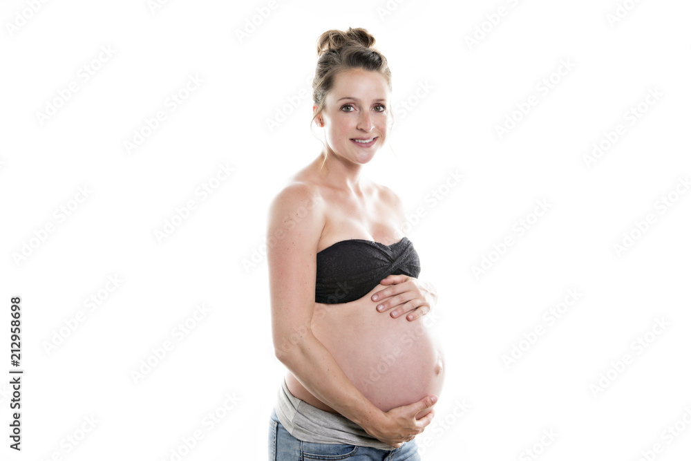 pregnant woman caressing her belly over white background pregnant woman caressing her belly over white background
