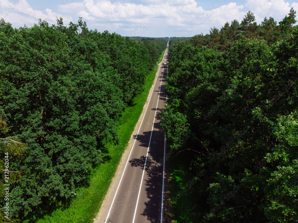 aerial view of straight highway. sunny day. car travel concept aerial view of straight highway. sunny day. car travel concept