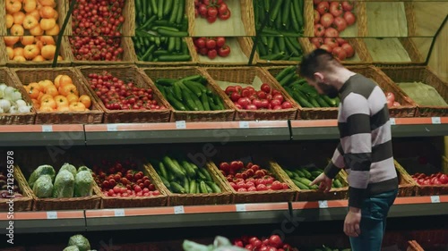 Young man shopping at the local supermarket