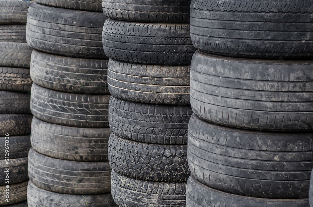 Old used car tires stacked in stacks Old used car tires stacked in stacks