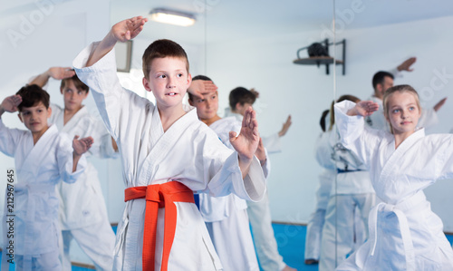 Children training new moves during karate class