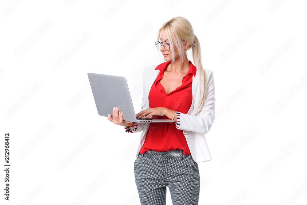 Business woman in a business suit and round glasses on a white isolated background holds a laptop in her hands. Check the financial report by e-mail Business woman in a business suit and round glasses on a white isolated background holds a laptop in her hands. Check the financial report by e-mail