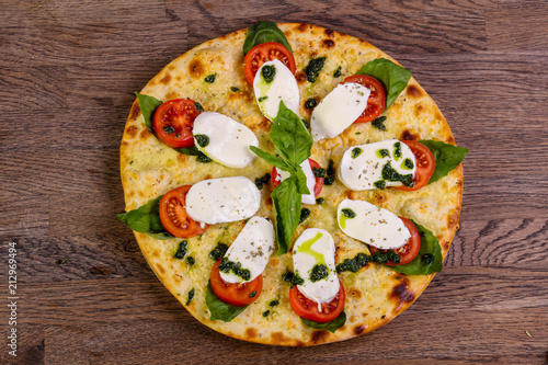 Pizza Caprese with basil