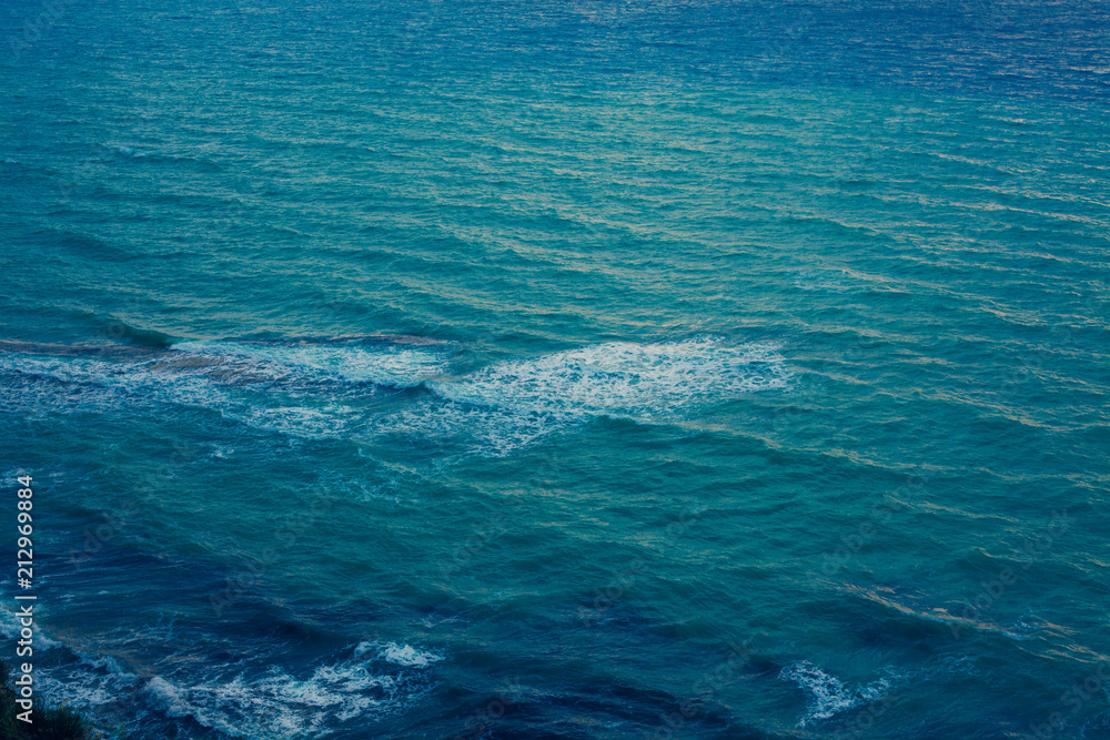 Deep Blue Ocean Surface with Waves and Foaming, Dark Turquoise Water Waving at the pace of the Breeze, Mediterranean Sea Landscape View from the Sky, Natural Marine Blue color Palette
