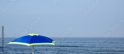 colorful summer beach umbrella on New England coast