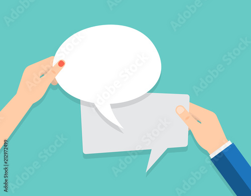 Hand holding an empty speech bubble