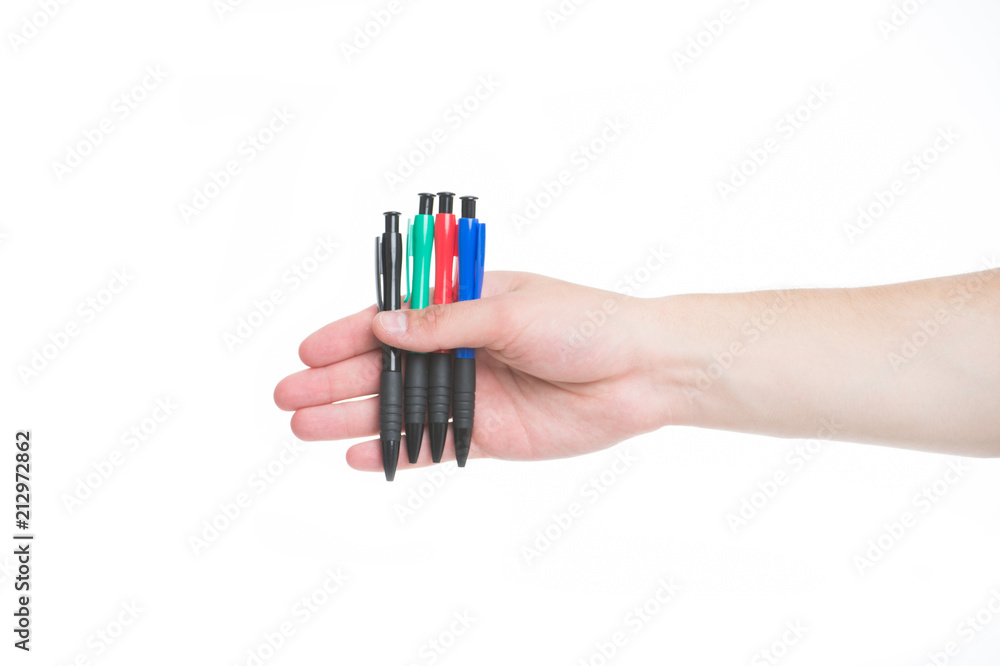 Male hand holds four pens isolated white background. Office stationery concept. He always ready to sign contract. Diversity of colorful pens. Take pen and leave me autograph. Sign document Male hand holds four pens isolated white background. Office stationery concept. He always ready to sign contract. Diversity of colorful pens. Take pen and leave me autograph. Sign document