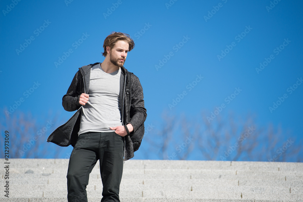 One more step. Man handsome guy enjoy morning walk blue sky