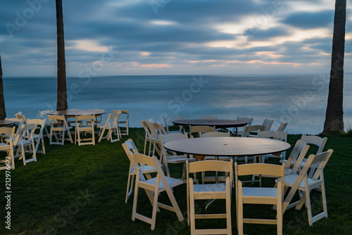 Table and chairs near the ocean and beach