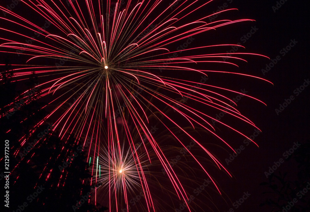 Red Explosion Fourth of July Fireworks on Lake Sawyer in Washington State Red Explosion Fourth of July Fireworks on Lake Sawyer in Washington State
