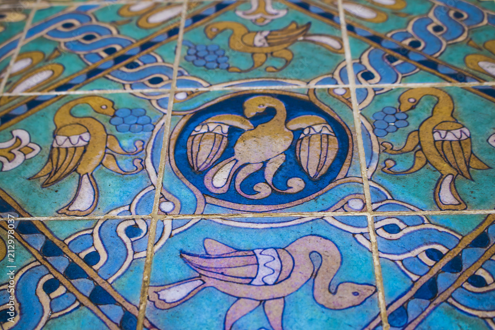 Closeup of a Beautiful Bird Design in Gold, Turquoise, and Blue in Los Angeles, California, USA
