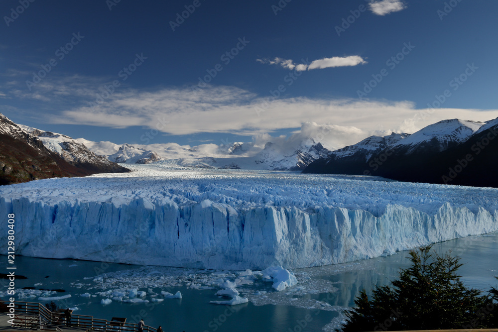Huge white glacier with blue sky